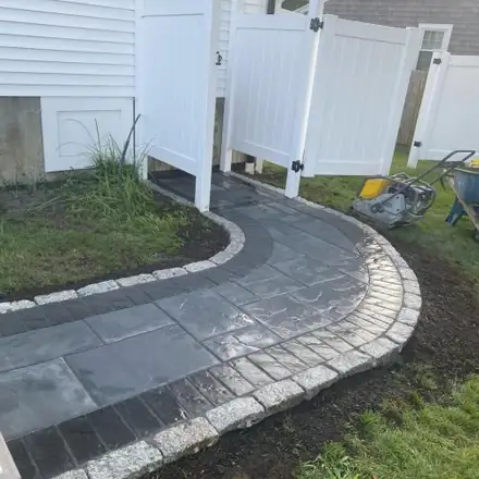 Curved paver walkway with granite edging